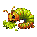 A segmented caterpillar with an orange head and green body eats green leaves against a black background.