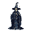 Tall, slender cloaked figure with a pointed hat, skeletal face, and flowing robe against a muted beige and dark blue/gray background.