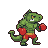 A green iguana wearing red boxing gloves and orange-striped shorts, in a boxing stance.