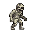 A shambling mummy with tattered bandages, dark hollow eyes, and a gaping maw with pixelated teeth.