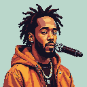 Rapper with dreadlocks and beard, wearing a burnt-orange hooded jacket with silver chains, holding a microphone and looking intensely forward.