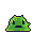 Green slime creature with large dark eyes and downturned mouth, appearing bewildered.