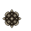 Dark metallic star with crystalline facets on black background.