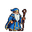 Pixel art wizard in a blue robe with gold trim, white beard, and pointed hat, holding a staff.