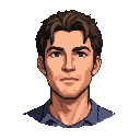 Young man with tousled brown hair, wearing a dark blue collared shirt, with a subtle shadow on his left cheek.