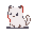 A fluffy white kitten with large dark eyes and a gentle expression, with subtle red accents on its ears and chest.