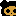 Golden pixelated skull on a black background.