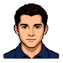 A young man with dark hair, warm skin, and a friendly gaze, wearing a dark blue collared shirt.