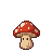 Anthropomorphic mushroom sprite with a red, white-spotted cap and light tan stem with blocky eyes.