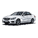 A white 2013 Mercedes E 350 sedan in a three-quarter front view against a black background, featuring its grille with the Mercedes-Benz star, sharp headlights, dark roofline, and alloy wheels.