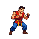 Martial artist in a red gi and blue pants, in a ready fighting stance.