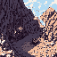 This pixel art image captures a dramatic mountainous landscape, showcasing contrasting dark and light rock formations in a rugged canyon setting. The scene evokes a sense of natural beauty and solitude with its earthy color palette and retro-game aesthetic.