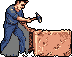 A pixel art figure, dressed in blue and grey, intensely carves a reddish-brown block with a pickaxe. The image captures a moment of focused labor and craftsmanship against a stark black void, evoking a retro feel.