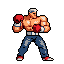 A pixelated, muscular boxer in jeans and red gloves stands ready to fight, his stern gaze conveying strength and focus. He wears a white bandanna and red and white shoes, his stance reminiscent of classic arcade fighting games.