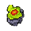 A vibrant, alien-looking eye or energy core dominates the image with its glowing chartreuse green mass and concentric red rings, partially encased in jagged, dark grey rock. The high-contrast colors and mysterious vibe hint at an unnatural and powerful entity.