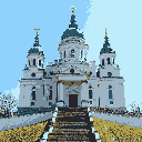 This pixel art showcases a majestic, multi-domed cathedral with intricate architectural details, rendered in a muted palette that evokes a sense of grandeur and historical significance. Golden cupolas adorn the structure, which rises high against a clear blue sky, inviting reverence and awe.