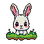 A charming pixel art image features an adorable white rabbit with rosy cheeks and big, sparkling eyes, peeking playfully over a patch of vibrant green grass. Its cute expression and retro style create a nostalgic and endearing scene.