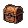 A pixelated, wooden treasure chest awaits discovery, its closed lid hinting at untold riches and secrets within. Rendered in earthy tones with subtle highlights and shadows, the chest embodies a sense of anticipation and mystery. It is a classic icon of adventure, promising reward in a retro game aesthetic.